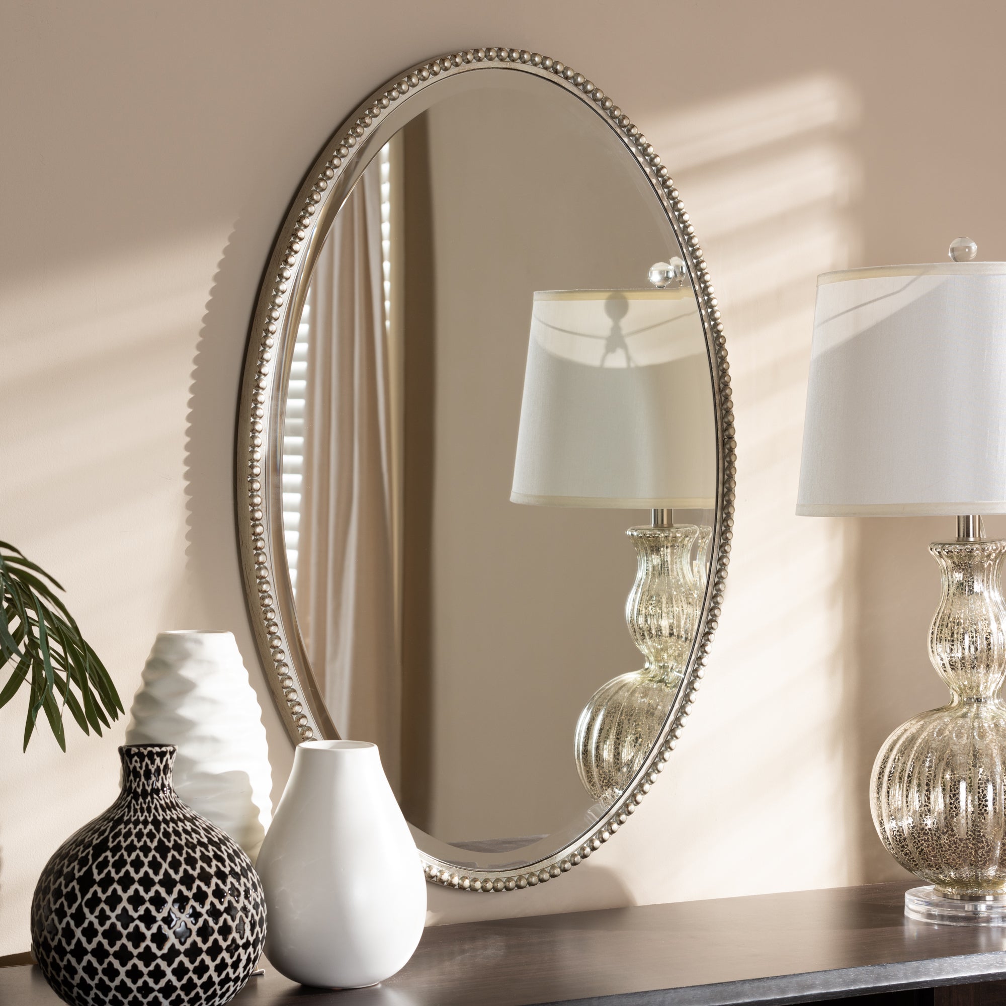 Graca Modern and Contemporary Antique Finished Oval Accent Wall Mirror